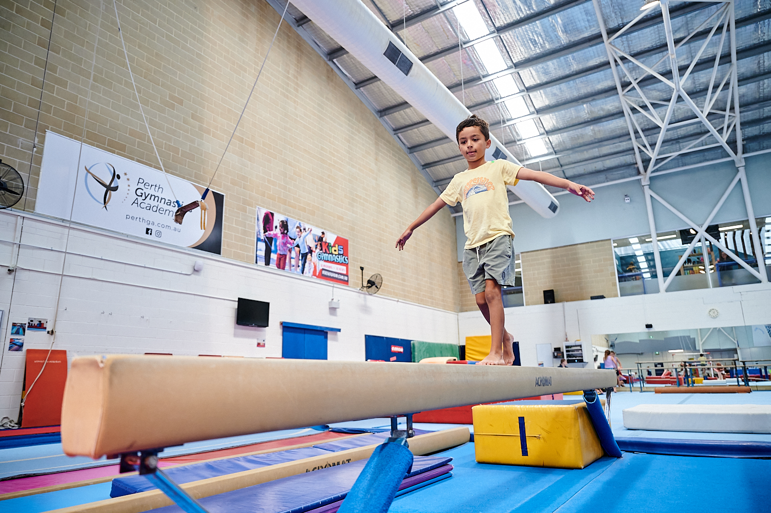 Photo of boy balancing on beam at Perth HPC Kids Gym class in Mount Claremont, Perth